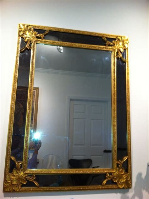 Hollywood Regency Large Gold Leaf Charcoal Black Glass Mirror For Sale