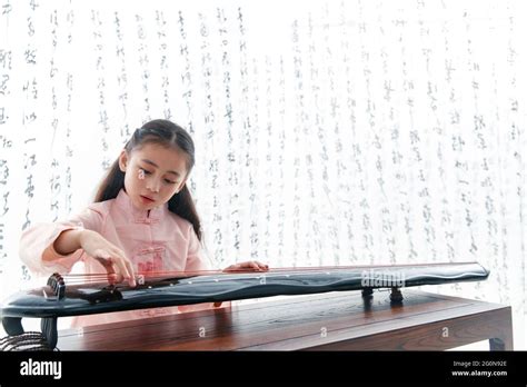 Playing The Chinese Zither Girl Stock Photo Alamy
