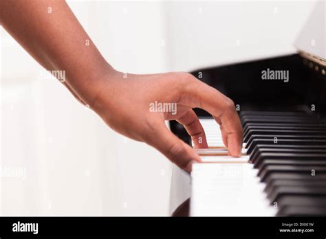 African American Hand Playing Piano Touching Piano Keys Black