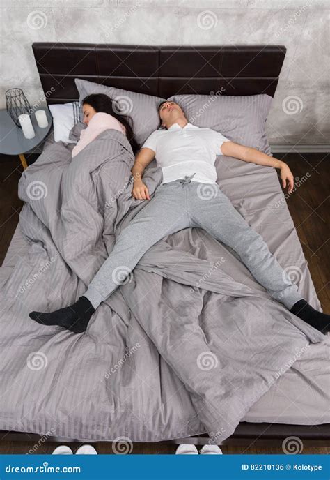 Young Man Sleeping In Free Fall Position With His Girlfriend Occupied