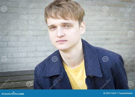 Handsome Young Man Sitting On A Bench Stock Photo Image Of Candid