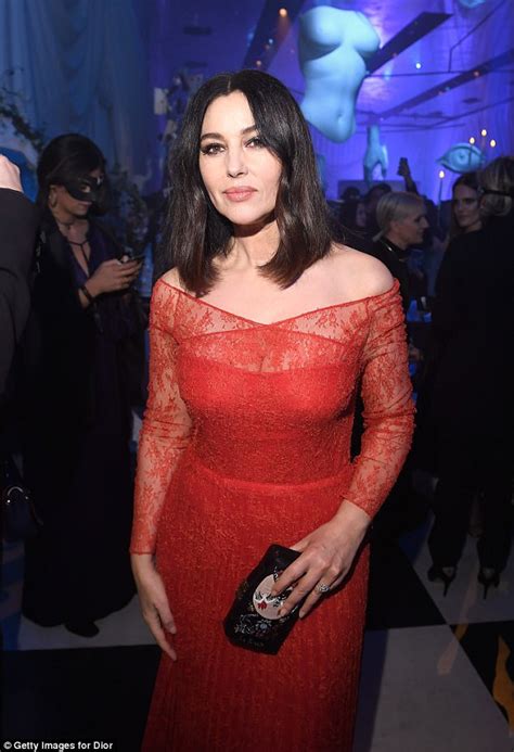 Monica Bellucci Is A Vision In Red In Curve Hugging Gown Daily Mail