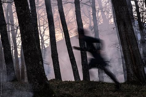 Blurred Woman Runs In Forest Fire By Stocksy Contributor Hakan Sophie Creepy Woods Dark