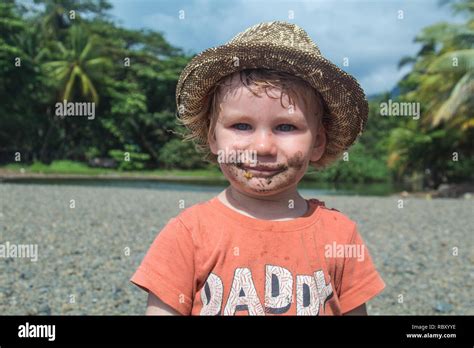 A Nice Portrait Of An Adorable Toddler Who Has Eaten Sand Mouth Is