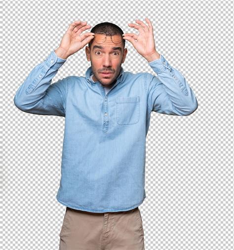 Premium Psd Concentrated Young Man With A Gesture Of Looking Far