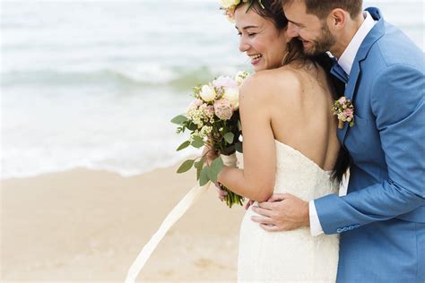 Youthful Mature Couple Getting Married At The Beach Royalty Free