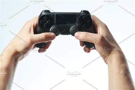 Hands Holding Black Game Controller Game Controller Hold On Holding
