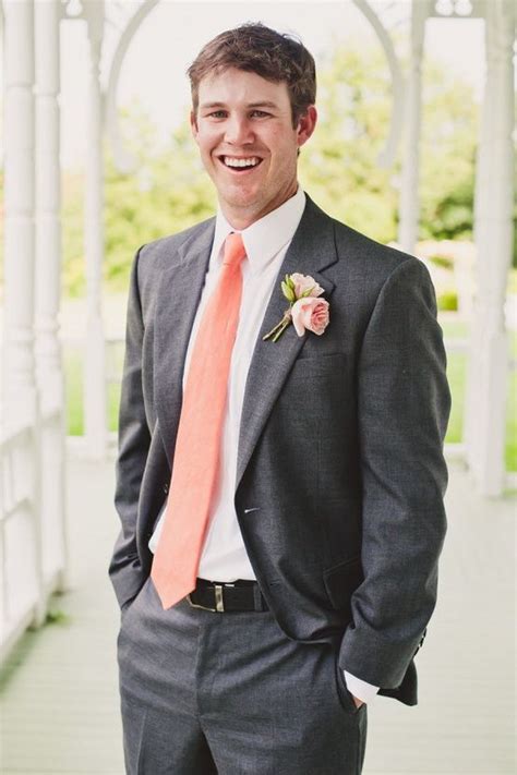 Use light pastel colours and pair your grey suit with a pair. Grey suit with salmon tie | Groomsmen grey, Salmon wedding ...