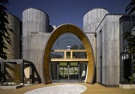 Adding arch in the front part of the house place makes you have a modern house. Contemporary Countryside Home with Oval Entrance and ...