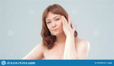 Mature Naked Woman Feels Headache Serious Red Haired Lady Touches Her