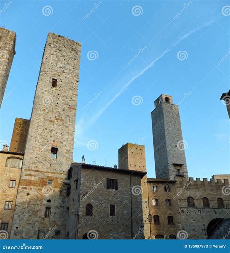 some of the famous towers of san gimignano in tuscany italy against deep blue sky stock image