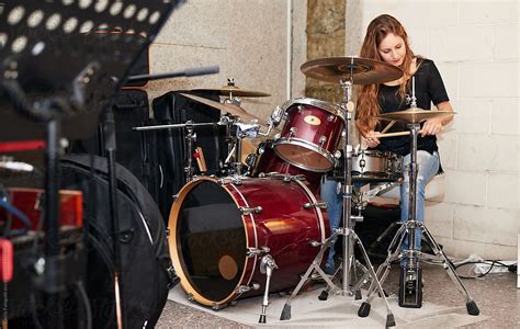 Pretty Woman Playing Drums By Stocksy Contributor Guille Faingold