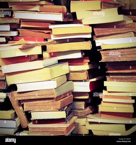 Piles Of Old Books For Sale In An Old Library With Vintage Toned Effect