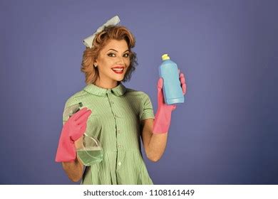 Retro Woman Cleaner On Blue Background Stock Photo