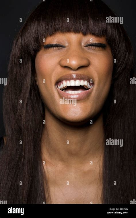 Portrait Of A Young Laughing Dark Skinned Woman Stock Photo Alamy