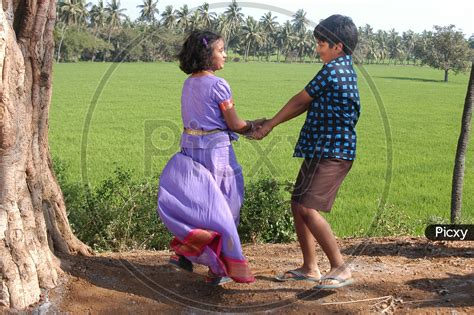 Image Of Indian Brother And Sister Playing In Agriculture Fields Mc523054 Picxy