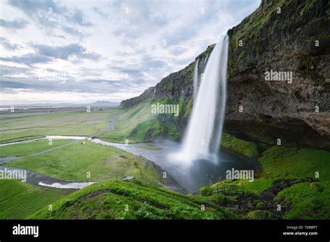 Seljalandsfoss Waterfall Summer Landscape With Cascade And A River