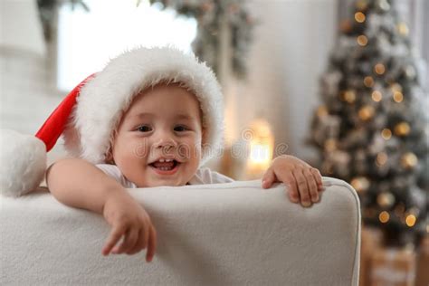 Cute Little Baby Wearing Santa Hat At Home Christmas Celebration Stock