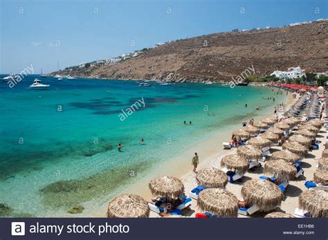 Thatched Umbrellas On Ornos Beach On Mykonos The Cyclades