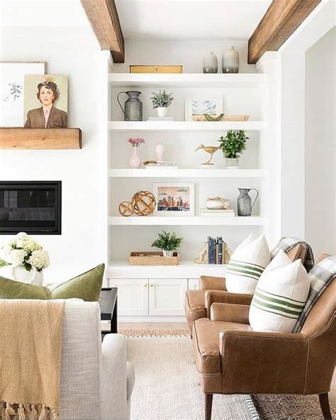 How To Decorate By Layering Your Artwork Mantle And Bookshelves