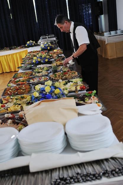 Premium Photo Catering Buffet Food Party Preparation Man