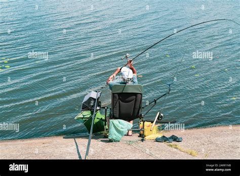 Man Sitting In Chair Fishing Hi Res Stock Photography And Images Alamy