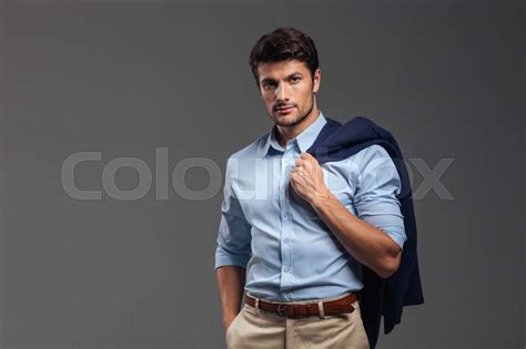 Handsome Businessman Holding His Jacket Over Shoulder Stock Image