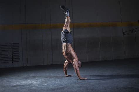 Why Mastering The Handstand Will Give You Stronger Abs Mens Journal