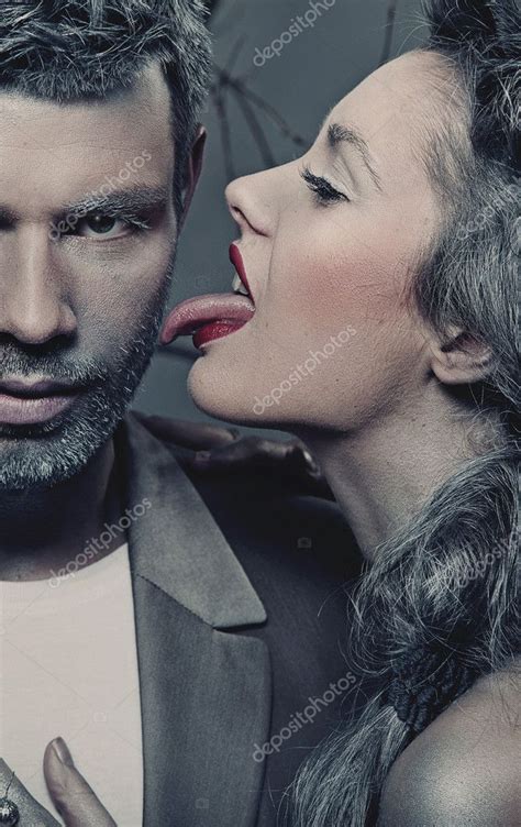 Woman Licking Man S Cheek Stock Photo Image By Konradbak