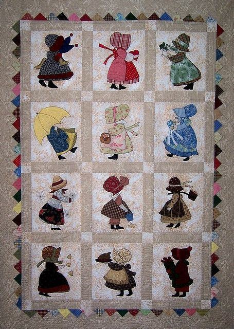 A Quilted Wall Hanging With Many Different Characters On Its Sides