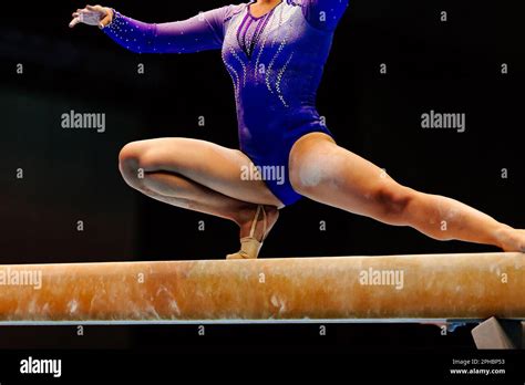Female Gymnast Athlete Balancing On Balance Beam Gymnastics Olympic