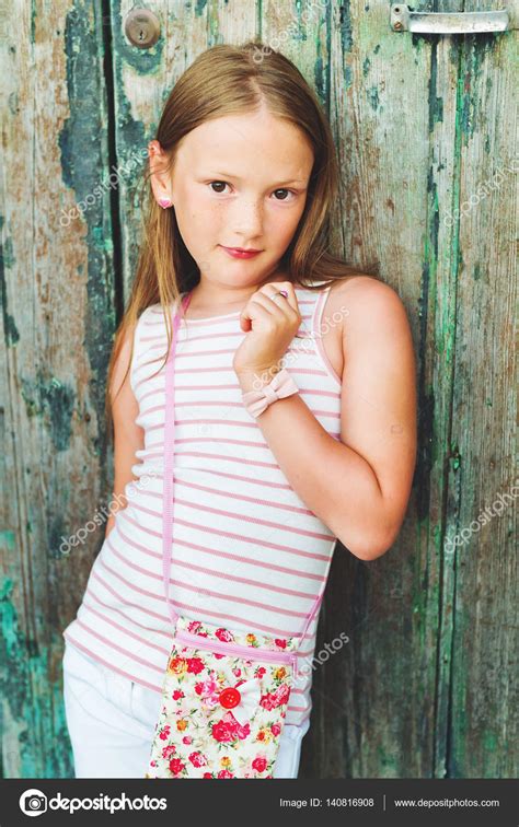 Continue reading to know more about these. Vertical portrait of a cute little 7-8 year old girl ...