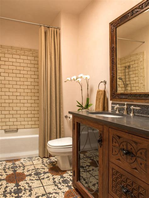 An eclectic bathroom with candles, a. Traditional Bathroom Design Ideas, Remodels & Photos with Terra-Cotta Tile
