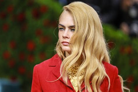 A Gold Painted Cara Delevingne Walked The Met Gala Red Carpet Topless So That S Fun Allure