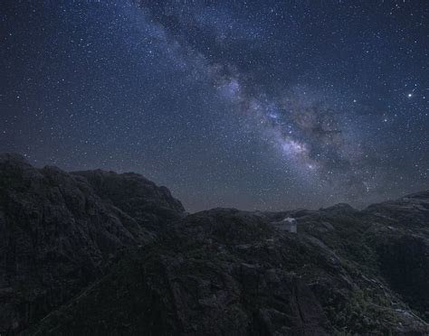 Starry Sky Over Mountainous Area At Night · Free Stock Photo