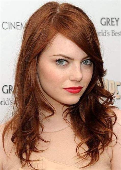quirky actress emma stone looks smoking hot with her dark auburn red hair color auburn is a