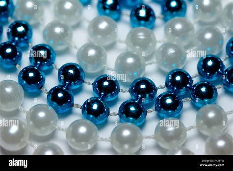 Macro Abstract Created With Blue And White Mardi Gras Beads Arranged In