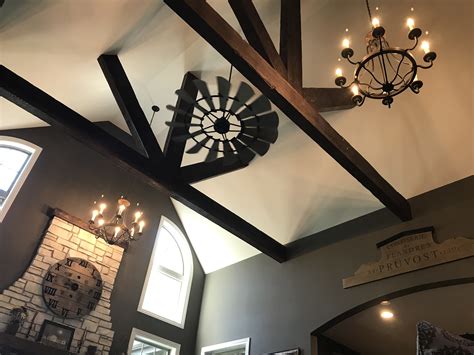 But a higher ceiling may mean higher construction and energy costs. Vaulted ceiling with windmill fan and rustic beams ...