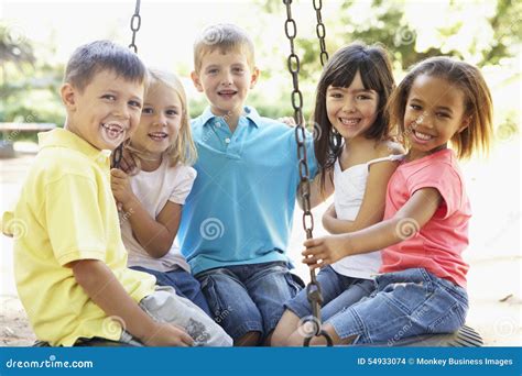 Group Of Children Having Fun In Playground Together Stock Photo Image