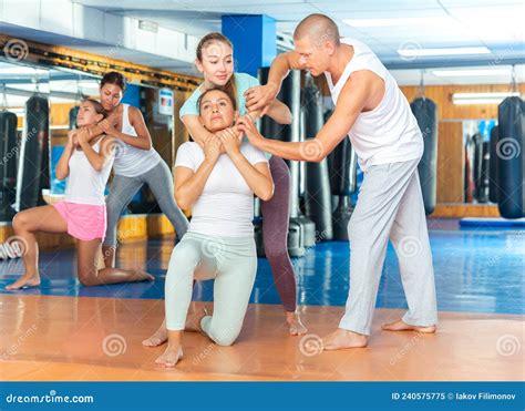 self defense instructor teaching women to perform guillotine choke stock image image of fight