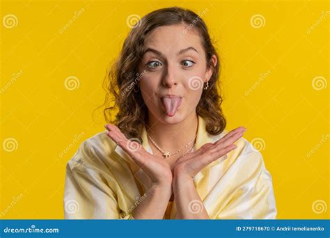 Funny Comical Woman Making Silly Facial Expressions And Grimacing Fooling Around Showing
