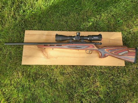 Savage 93r17 Heavy Blued Barrel With Laminated Stock With Scope Reduced