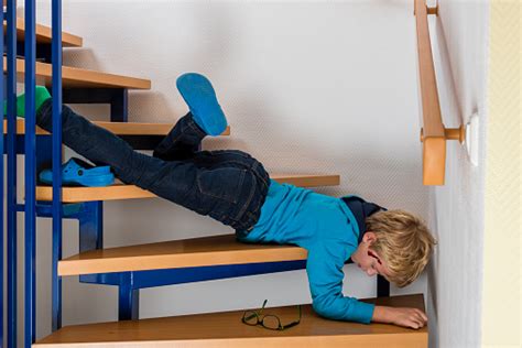Accident Child Falling Down The Stairs At Home Stock Photo Download