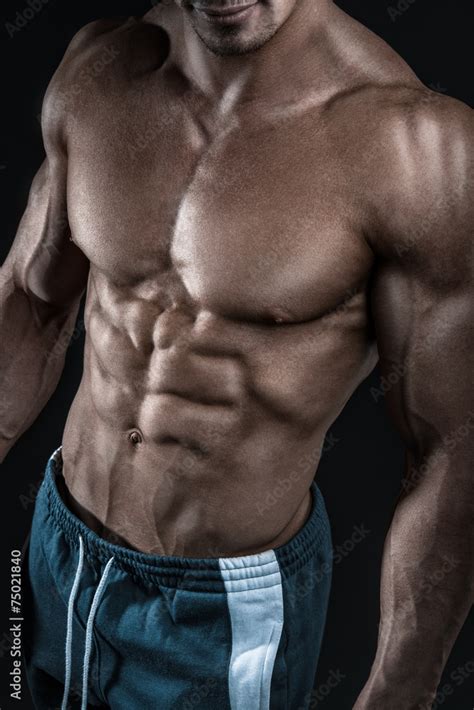 Strong Athletic Man Fitness Model Showing Torso Muscles Stock Photo
