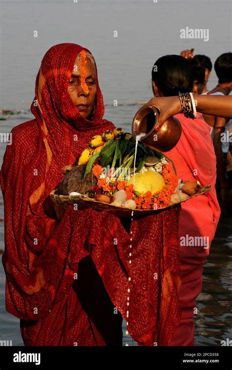 A Hindu Devotee Offers Prayers To The Sun God On The Occasion Of Chhat