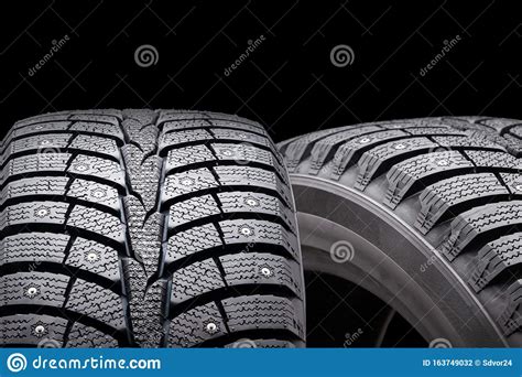 New Winter Studded Tires Isolate On A Black Background Conceptfront