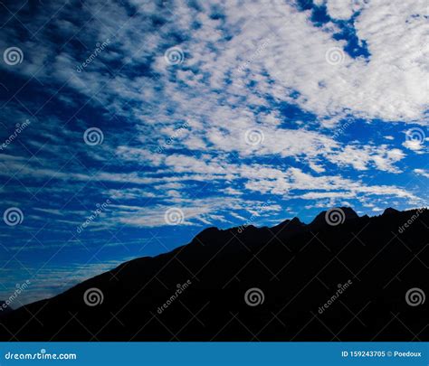 Skyscape Heavenly Fleecy Clouds Over The Swiss Alps Stock Image