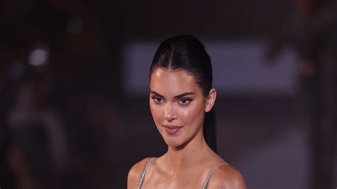 kendall jenner drops jaws in sparkling silver gown as she struts down the runway to close the l