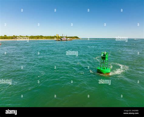 Aerial Photo Of A Green Channel Market Buoy At The Fort Pierce Inlet