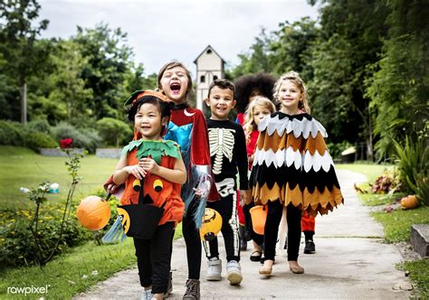 Download Premium Image Of Young Kids Trick Or Treating During Halloween